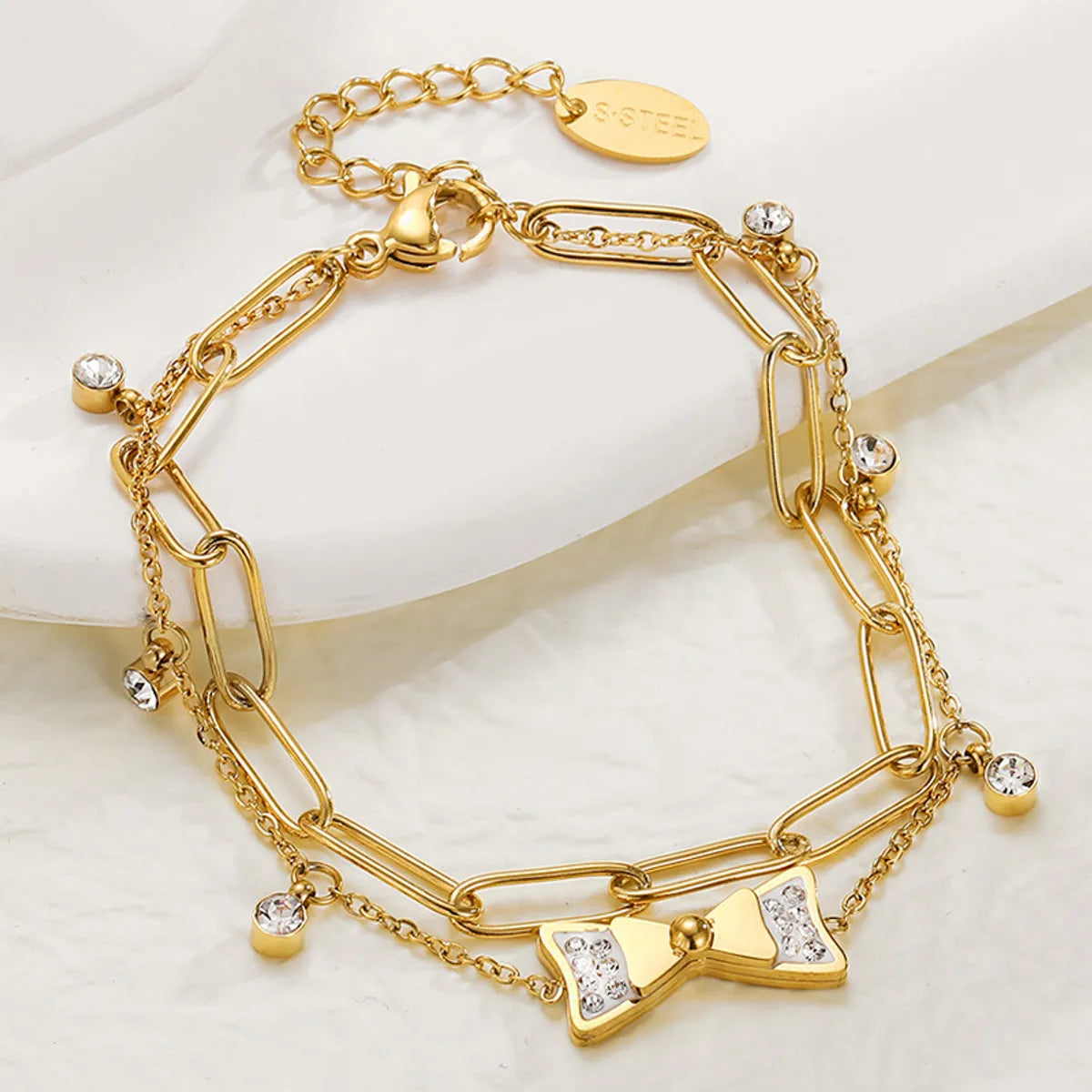 women's lucky charm bracelets-Fashion Zircon Inlaid Bow Pendant 14k Gold Plated Titanium Steel Bracelet